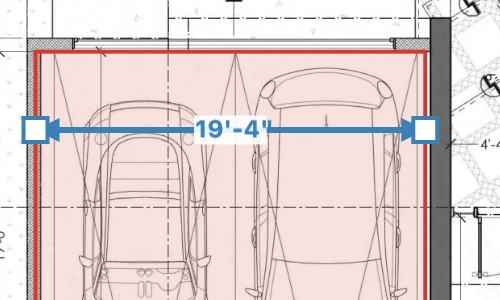 A blue ruler across the garage showing 19 feet 4 inches